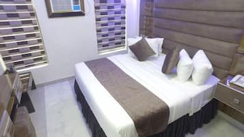 Economy Room, Balcony, City View | Desk, laptop workspace, blackout drapes, soundproofing