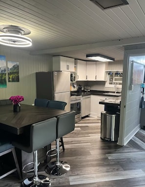 Enjoy meals in the kitchen with an oven and microwave, and dine at the wooden table.