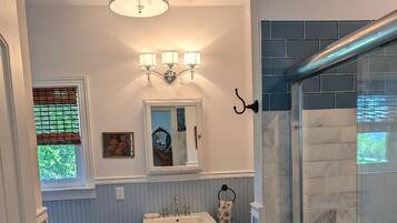 Shower, hair dryer, towels, soap