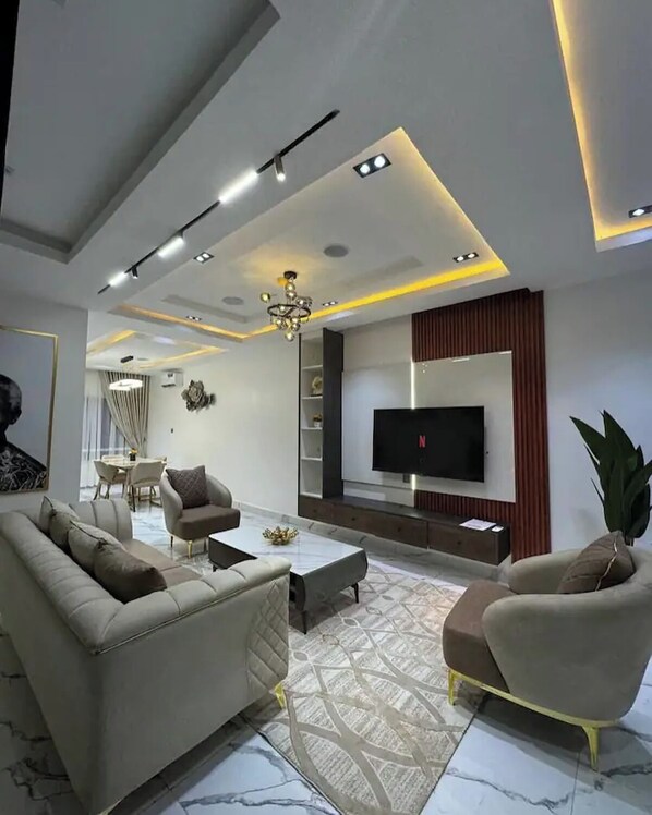 Family Apartment, Balcony, City View | Living area | Flat-screen TV - Jayz Shortlet Apartment (Abuja)