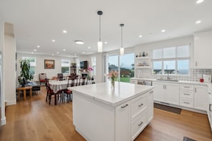 Enjoy meals in the spacious kitchen with a large island and dining area.