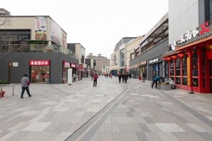A pedestrian street with shops and restaurants. - Shanghai Comet Hotel (Shanghai)