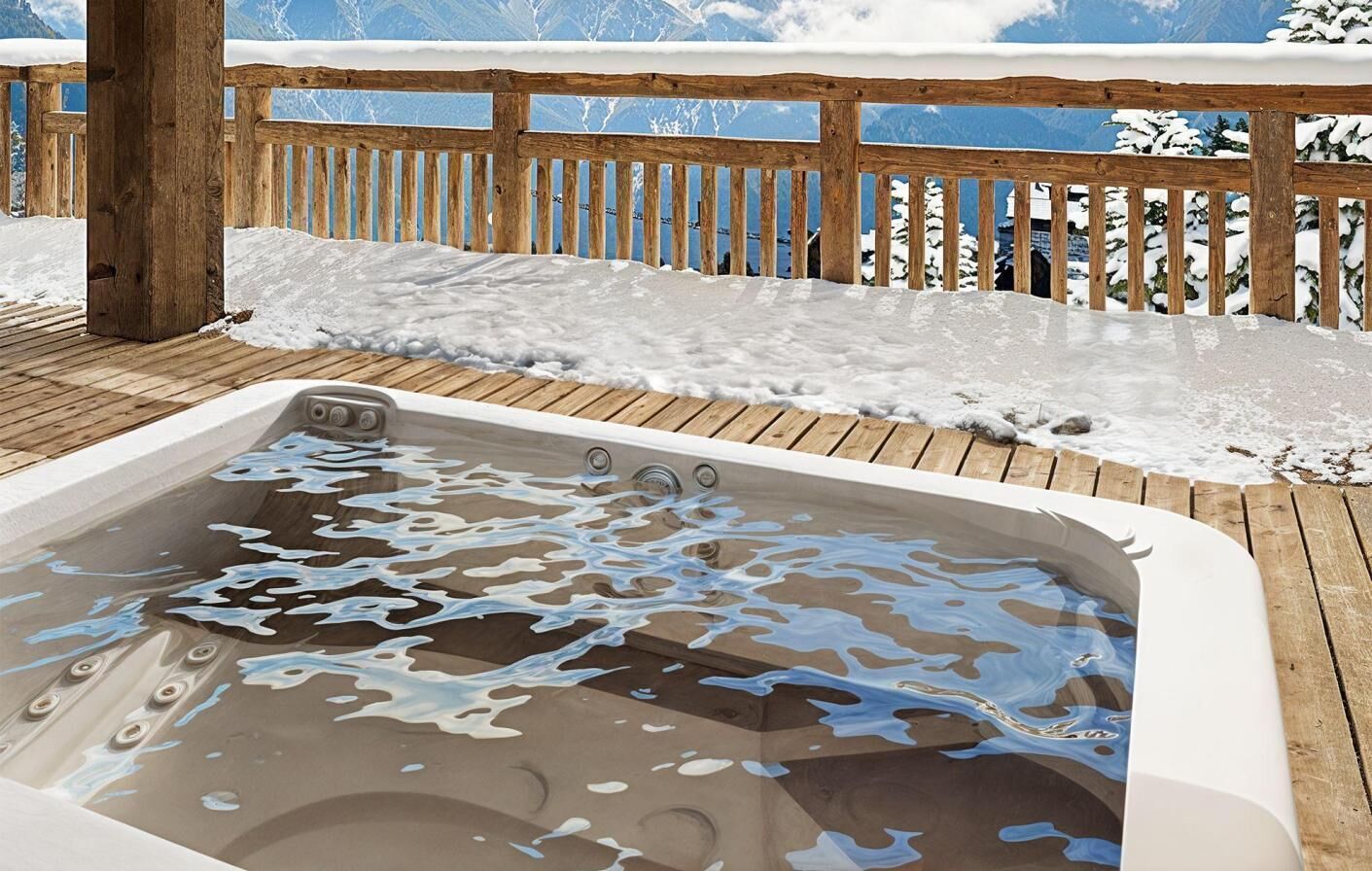 A wooden deck with a hot tub surrounded by snow.