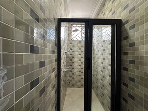 Shower, towels, soap, toilet paper