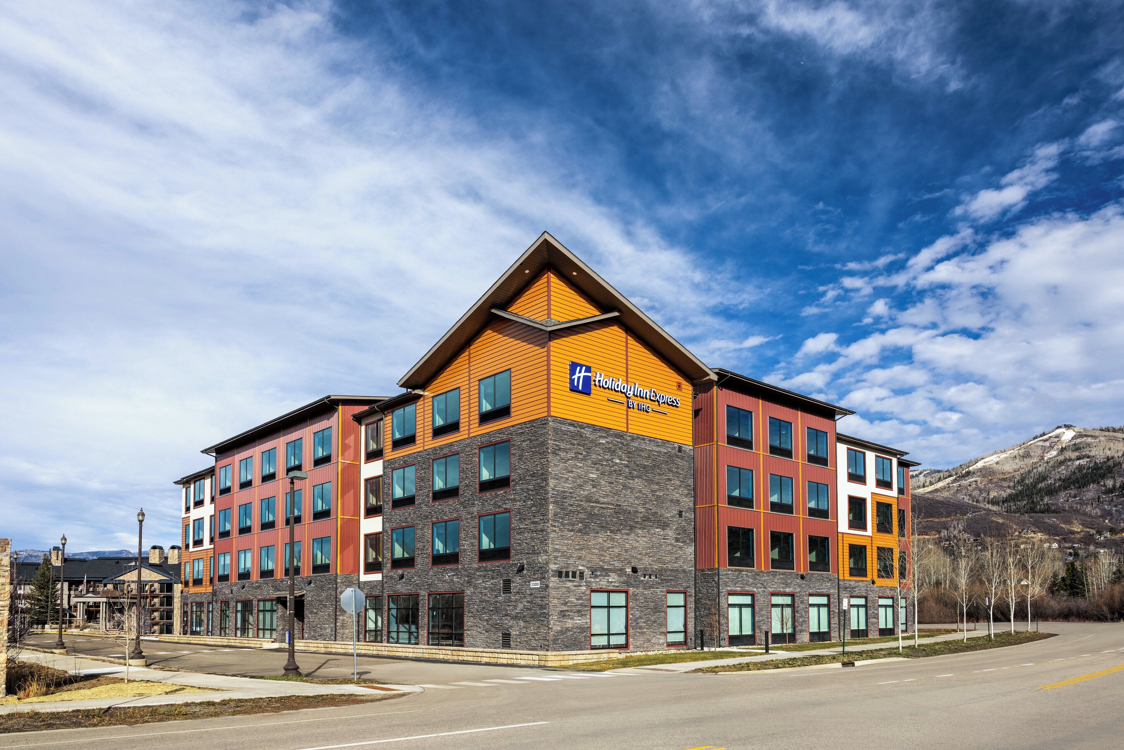 A Holiday Inn Express hotel with a modern design, featuring multiple floors and a prominent entrance.