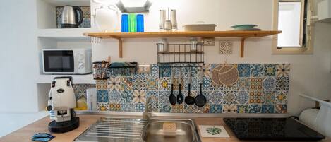 Fridge, microwave, stovetop, coffee/tea maker