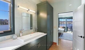 Shower, hair dryer, towels, toilet paper