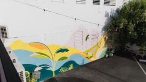 A colorful mural on a building's exterior wall.
