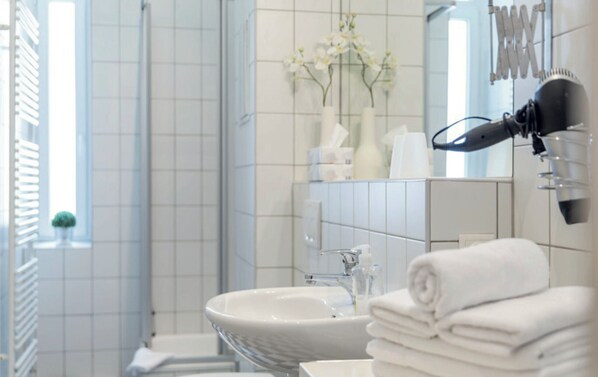 Hair dryer, towels, soap, shampoo