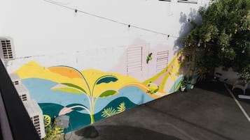 A colorful mural on a building's exterior wall.