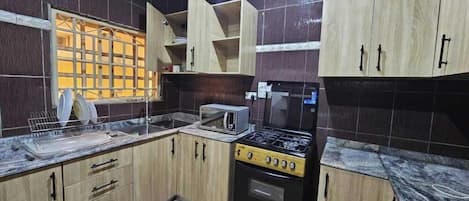 Comfort Apartment, Balcony, City View | Private kitchen | Fridge, microwave, oven, stovetop