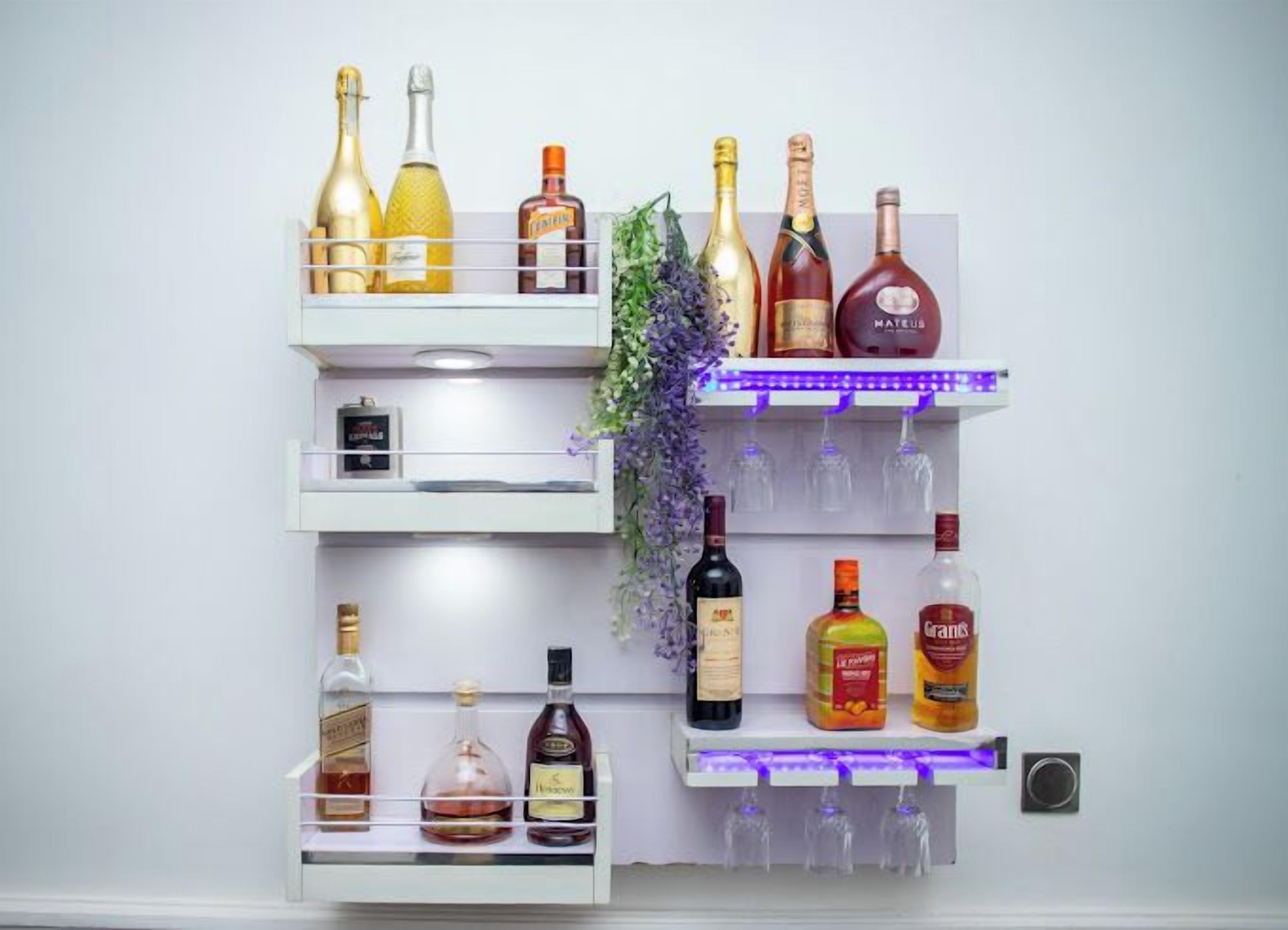 A wall-mounted liquor cabinet with multiple shelves holding various bottles and glasses.