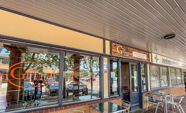 Experience the charm of The Grindy Grill, a restaurant with a warm and inviting atmosphere.