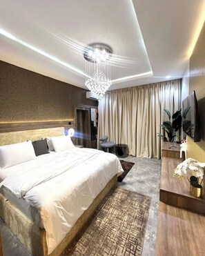 Deluxe Apartment, Balcony, City View | 1 bedroom, in-room safe, desk, laptop workspace - Winnie Host and Homes (Abuja)