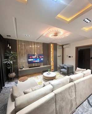 Deluxe Apartment, Balcony, City View | Living area - Winnie Host and Homes (Abuja)