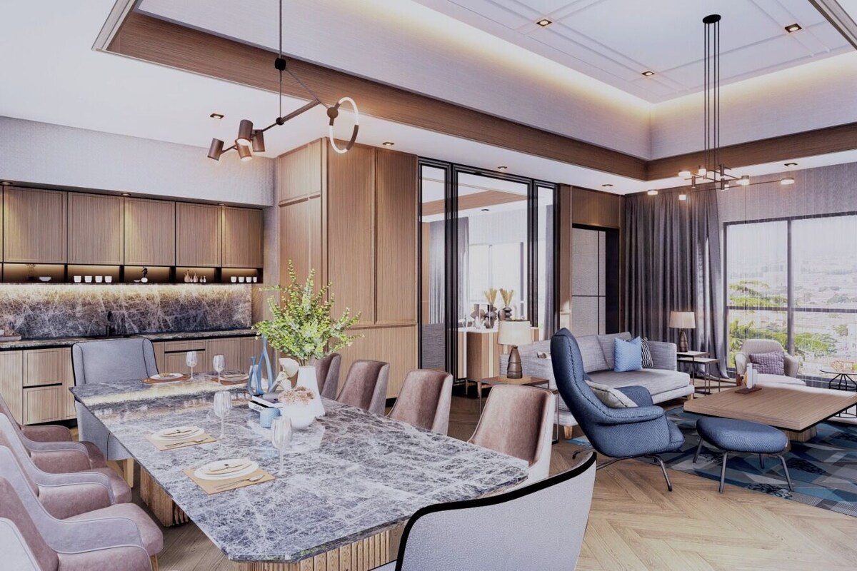 A modern interior with a dining area, sofas, and a large window offering a city view.