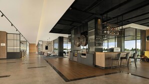 A modern bar area with a high ceiling, wooden flooring, and a bar counter with stools. - Four Points By Sheraton Pontianak (Pontianak)