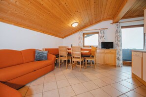 Classic Apartment, Multiple Beds, Balcony, Mountain View | Living area | 50-inch flat-screen TV with cable channels