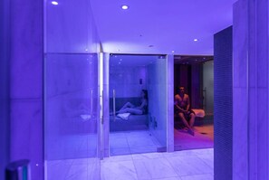 A modern bathroom with a glass shower enclosure and a separate shower area. - Student Only Walnut Gardens (Exeter)