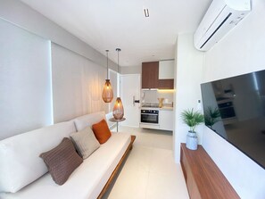Appartement Deluxe | Coin séjour | Télévision à écran plat