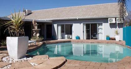 Orchard Guesthouse Deluxe Family Room with pool view
