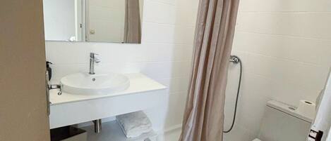 Shower, hair dryer, towels, toilet paper
