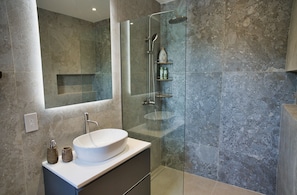 Shower, hair dryer, towels, soap