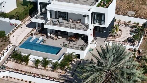 A modern two-story building with a rooftop patio, a swimming pool, and a landscaped garden. - AZUR -  NEW SEA SIDE DR, 4 BR, 4.5 BA -  WALK TO  INDIGO BEACH (Sint Maarten)