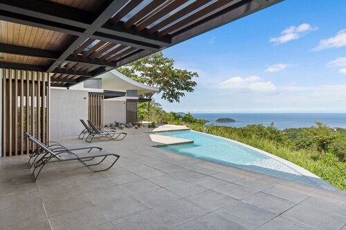 Luxurious Ultramodern Property with Private Suites, Infinity Pool, and Sweeping Ocean and Mountain Views
