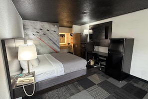 Desk, laptop workspace, blackout drapes, iron/ironing board - Eglin Extended Stay Hotel, a Howard Johnson by Wyndham (Niceville)