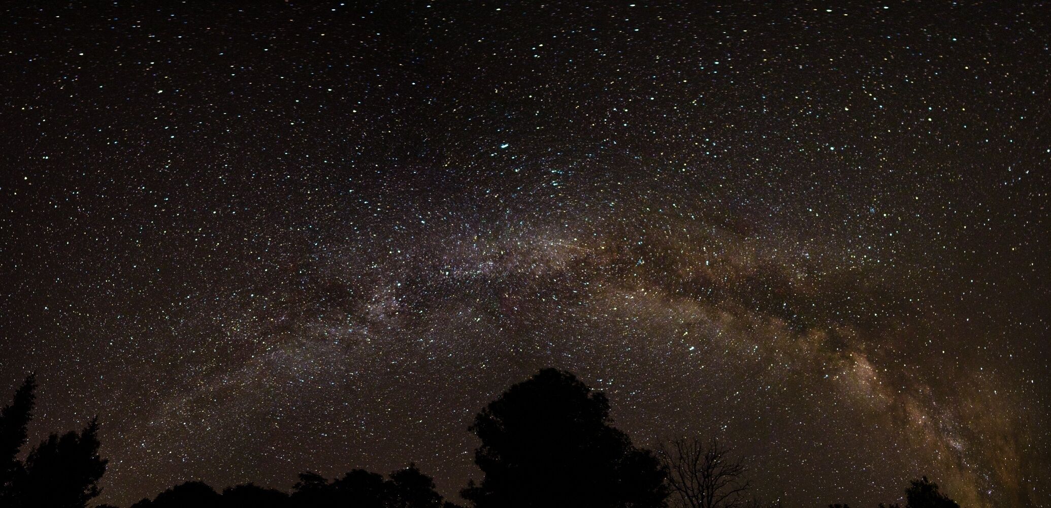 A night sky filled with stars and the Milky Way.