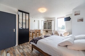 Fer et planche à repasser, draps fournis