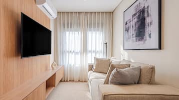 Premium Apartment, 1 Double Bed, City View | Living room | 43-inch Smart TV with satellite channels