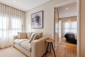 Premium Apartment, 1 Double Bed, City View | Living room | 43-inch Smart TV with satellite channels