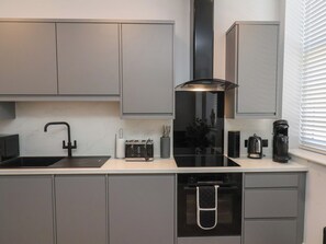 Cottage | Private kitchen | Dishwasher, cookware/dishes/utensils - 2 Bedroom Deluxe (Scarborough)