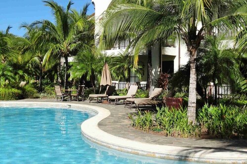 Ground-floor unit in front of lazy river pool at Pacifico in Coco