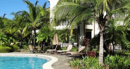 Ground-floor unit in front of lazy river pool at Pacifico in Coco