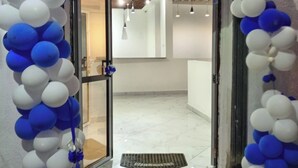 A doorway framed by a blue and white balloon arch. - The Grand Alton resort (Kisumu)