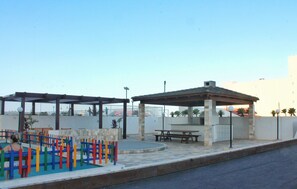 Apartamento | Restaurante al aire libre