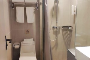 A modern bathroom with a glass shower enclosure, a toilet, and a sink. - Ease Hotel (Hangzhou West Lake Huanglong Sports Center Wensan Road Branch) (Hangzhou)