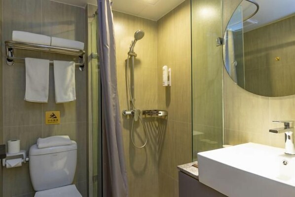 A modern bathroom with a glass-enclosed shower, a white sink, and a toilet. - Ease Hotel (Hangzhou West Lake Huanglong Sports Center Wensan Road Branch) (Hangzhou)
