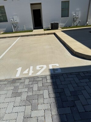 Park your car in designated space 1495, adjacent to the building.