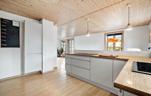 Fridge, stovetop, dishwasher, coffee/tea maker