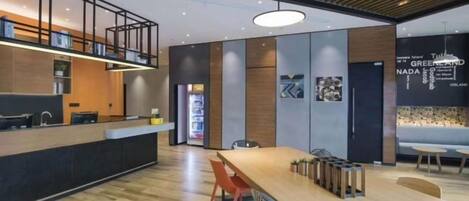 A modern kitchen with a wooden countertop and a built-in oven.