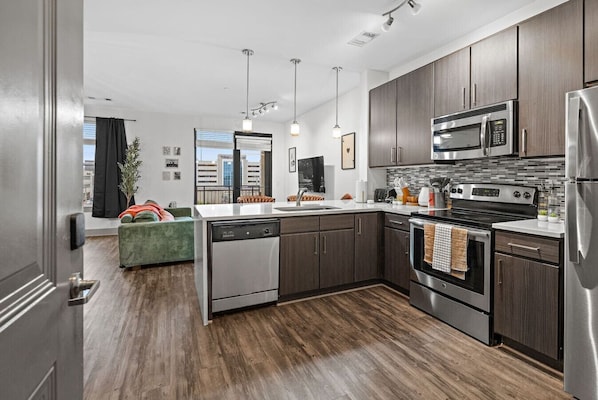 Fridge, dishwasher, coffee/tea maker, dining tables