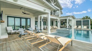 A modern outdoor pool area with lounge chairs, a small pool, and a covered seating area. - 3108 Palm by Avantstay Oceanfront, Private Pool, Incredible Views (Isle of Palms)