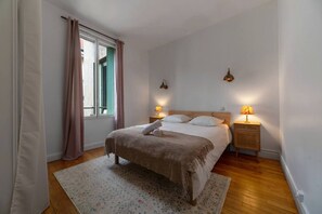 1 bedroom, desk, iron/ironing board, travel crib