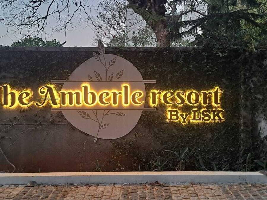 A sign for The Amberle Resort by LSK.