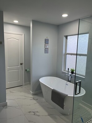 Shower, hair dryer, towels, soap