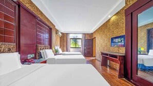 A hotel room with two beds, a wooden bench, a small table, and a large mirror. - Taizhou Western Style Hotel (Taizhou)